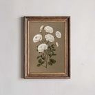 Framed botanical illustration of white flowers on a beige background
